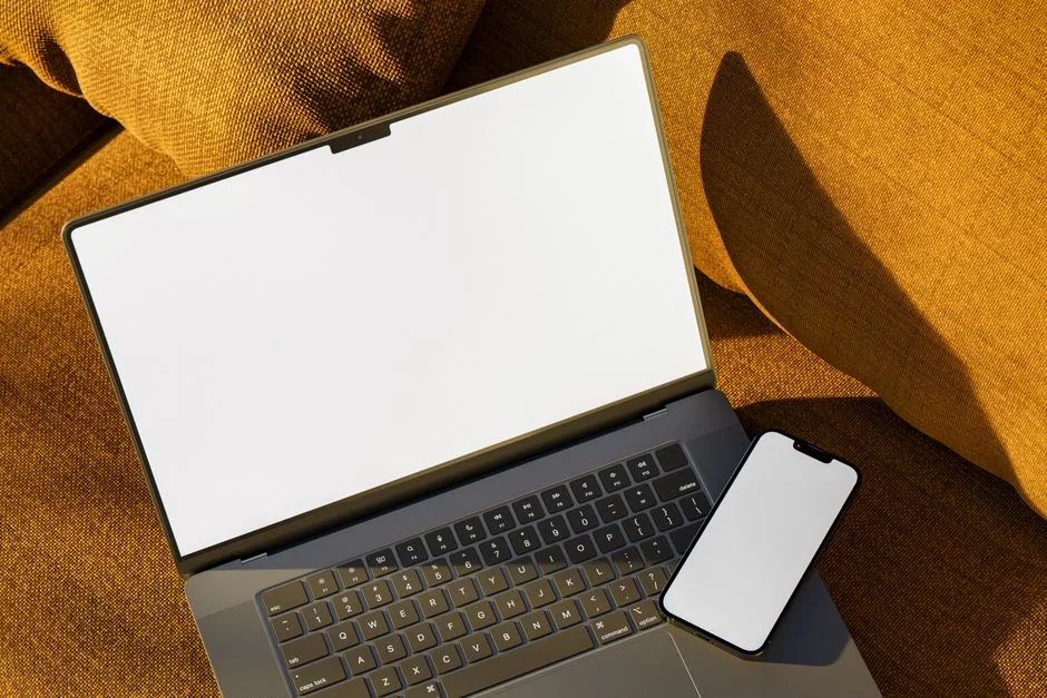 A person using a laptop to browse stock photo websites. Freelancing work in a cozy setting.